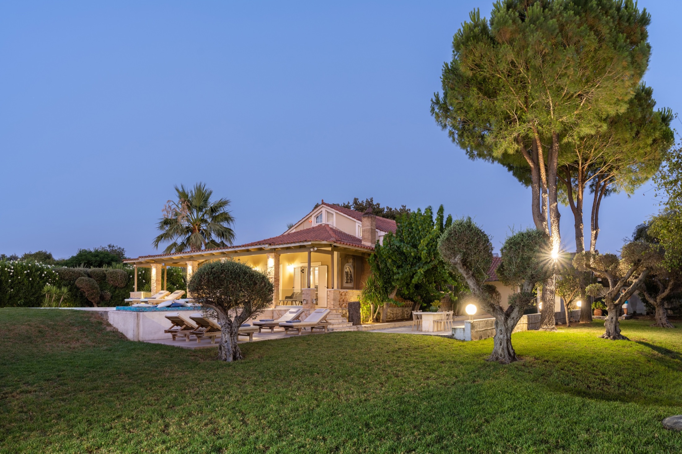 Dream Villa and private garden at dusk